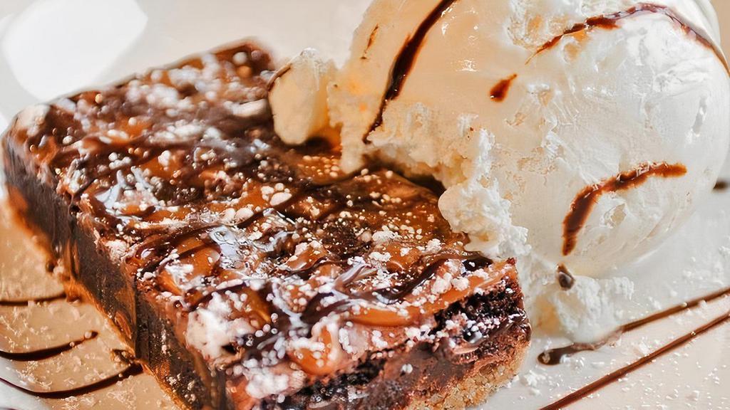 Salted Caramel & Chocolate Brownie · chocolate brownie, pretzel crust, sea salted caramel, vanilla bean ice cream