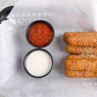 Mozzarella Sticks · Jalapeño  peppers stuffed with cheese, breaded and deep-fried to perfection.