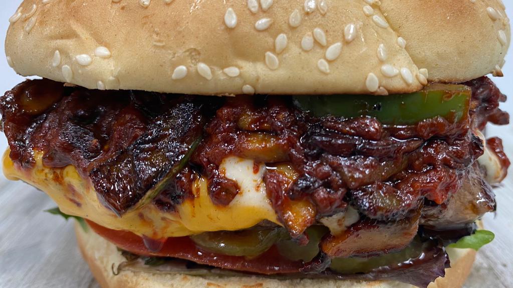 Chipotle Cheeseburger · Grilled onions, grilled mushrooms, sautéed red and green peppers, chipotle sauce, American and Swiss cheese, lettuce, tomato, pickles and mayo.