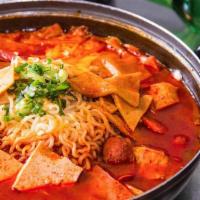 Army Stew · Tofu ramen, ham, sausage, spam, thin belly bacon, kimchi, scallion, sliced rice cake, fish c...