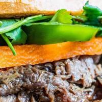 Ribeye Banh Mi · Choice of protein served with Vietnamese buttery mayo, chicken liver pate (except Salmon & T...