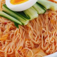 Bibim Goksu · Cold wheat noodles in spicy kimchi mixture topped with cucumbers and boiled egg