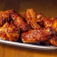 Wings (16 Pieces) · Tasty spicy hot chicken wings.  Also available in BBQ flavor. Served with ranch dressing (ot...
