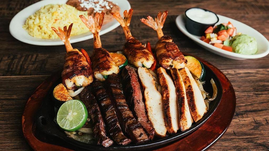 Veracruz · Sizzling Fajitas + (4) brochette-style shrimp wrapped in bacon, stuffed with Mexican panela cheese and jalapeño.