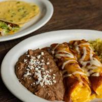 Zapata · Queso chip, crispy beef taco & two cheese enchiladas, topped with chili con carne.