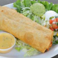 Chimichanga · A fried burrito: salsa-style chicken, ranchero sauce & cheese - guacamole, sour cream and qu...