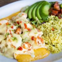 Seafood Enchilada Dinner · Two cheese enchiladas smothered in our white wine cream sauce with sautéed shrimp & crawfish...