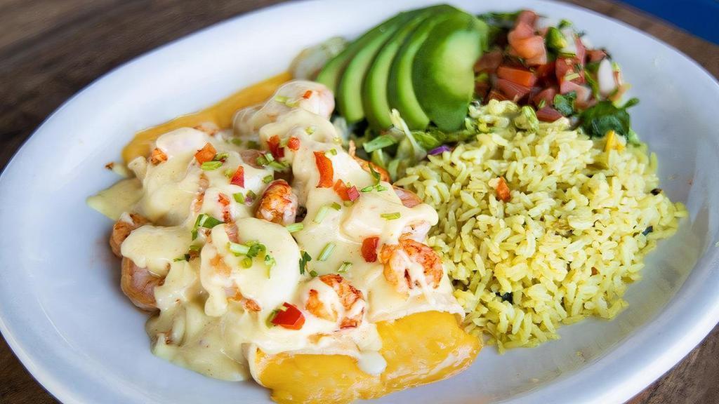Seafood Enchilada Dinner · Two cheese enchiladas smothered in our white wine cream sauce with sautéed shrimp & crawfish tails -- served with rice and beans.