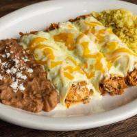 Chicken Enchilada Dinner · Salsa-style chicken rolled in white corn tortillas, with poblano cream sauce.