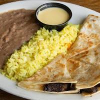 Kid Quesadillas · Flour tortillas stuffed with melted cheese served with refritos & Mexican rice. *With meat a...