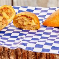 Beef And Potato Empanada · Shredded Beef with Potato Served with Aji sauce on the side.
