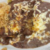 Beef Enchiladas · Beef‎ enchiladas with a Chile con carne sauce served with rice and beans.