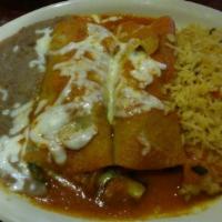Shrimp Enchiladas · Shrimp and spinach enchiladas with vegetables topped with a Mexican sauce, served with rice ...