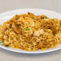 Cơm Chiên Ga · Stir-fried jasmine rice, carrots, peas, and scrambled eggs with chicken protein.