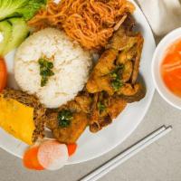 Cơm Bì Sườn Chả Trứng · Steamed rice with pork chop, pork skin and egg meat loaf with pork.
