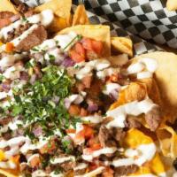 Slow-N-Low Pulled Pork Nachos · Pulled pork and sour cream