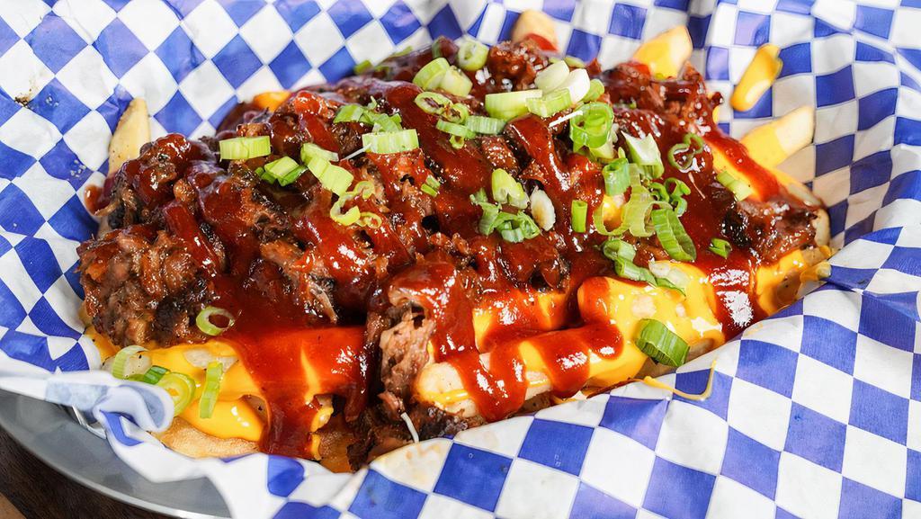 Slow-N-Low Pulled Pork Fries · Pulled pork topped with BBQ