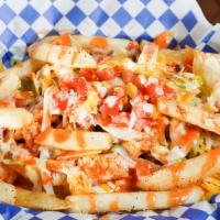 Buffalo Chicken Fries · Sautéed chicken in wing sauce, shredded lettuce, fresh diced tomatoes, shredded cheese toppe...