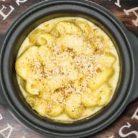Wtth Mac & Cheese · Made to order. Elbow macaroni in a creamy cheddar cheese sauce topped with panko and Parmesa...