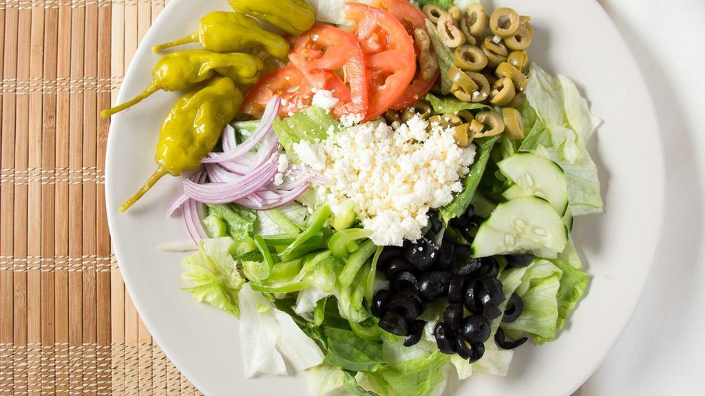 Greek · Virgin olive oil, beef, tomatoes, feta, bell peppers, onions, black, and green olives, artichoke.