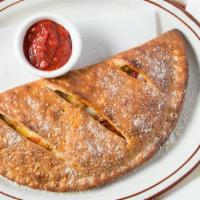 Calzone - Medium · Turned over pizza, filled with ricotta, mozzarella, and your favorite topping(s), baked and ...