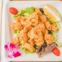 Fried Calamari · Battered squid, deep fried, served over baby greens, with spicy mayo on the side.