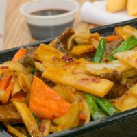 Mongolian Beef · Sliced beef quick fried with bamboo shoots and green onions and carrots in a special sauce.