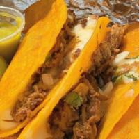Taco Combo · Three taco combo with or without cheese topped with onions and cilantro. Served with a small...