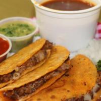 Birria Taco (1 Pc) · One beef birria taco on a corn tortilla. Served topped with onions and cilantro.