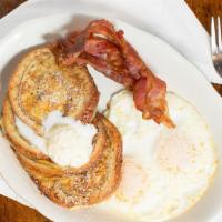 4 Piece Cinnamon French Toast Combo · Four pieces cinnamon swirl french toast served with two eggs any style, and two bacon, or on...