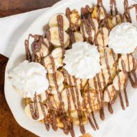 Banana Nutella Crepes · Fresh sliced bananas stuffed into our crepes, then drizzled with hazelnut chocolate Nutella,...
