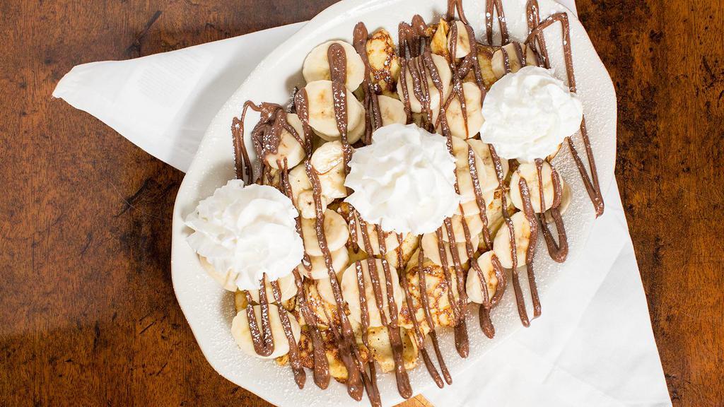 Banana Nutella Crepes · Fresh sliced bananas stuffed into our crepes, then drizzled with hazelnut chocolate Nutella, topped with whipped cream.