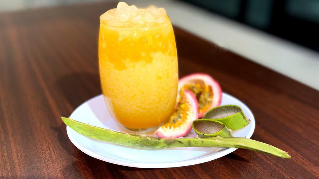 Honey Passion Fruit Sago · Passion Fruit or Markisa (as it is known in Indonesia) puree sweetened with honey. 
Coupled with sago, Passion Fruit popping and Aloe Vera.