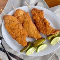 Chicken On A Stick · Our tribute to fiesta served year around with no lines. Three breaded chicken cutlets tossed...
