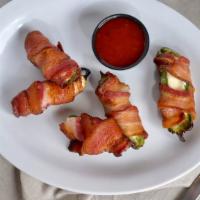 Bacon Wrapped Jalapeno Poppers(3) · Crispy bacon wrapped around fresh jalapenos stuffed with cream cheese. Served with ranch and...
