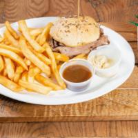 Roast Beef On Weck · Slow roasted roast beef piled high and served on freshly baked kimmelweck roll.