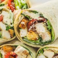 Chicken Caesar Wrap · Grilled sliced chicken with chopped romaine, tomatoes, Parmesan cheese, croutons, and Caesar...