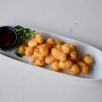 Beer Battered Cheese Curds · Crispy fried cheese curds, coated in tempura beer batter. Served with sweet jalapeño jam.