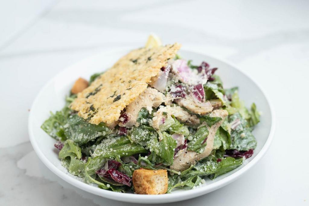 Caesar Roasted Chicken · Roasted chicken, ciabatta croutons and shredded Parmesan cheese, fresh crisp romaine, arugula & radicchio spring mix. Served with Caesar dressing.. *Items are served raw or undercooked.  Consuming raw or undercooked eggs may increase your risk of foodborne illness*