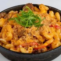 Spicy Sausage Mac And Cheese · Cavatappi pasta sautéed with Parmesan cream sauce, spicy Italian sausage, red pepper, Swiss,...