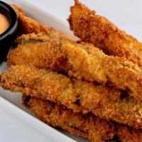 Freakin' Good Pickles · Crispy coated dill pickles, deep fried and served with Sriracha dipping sauce.