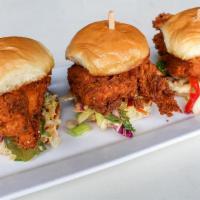 Spicy Fried Chicken Sandies · Tender chicken marinated jalapeño & buttermilk, dusted in spicy flour and crispy fried.Toppe...