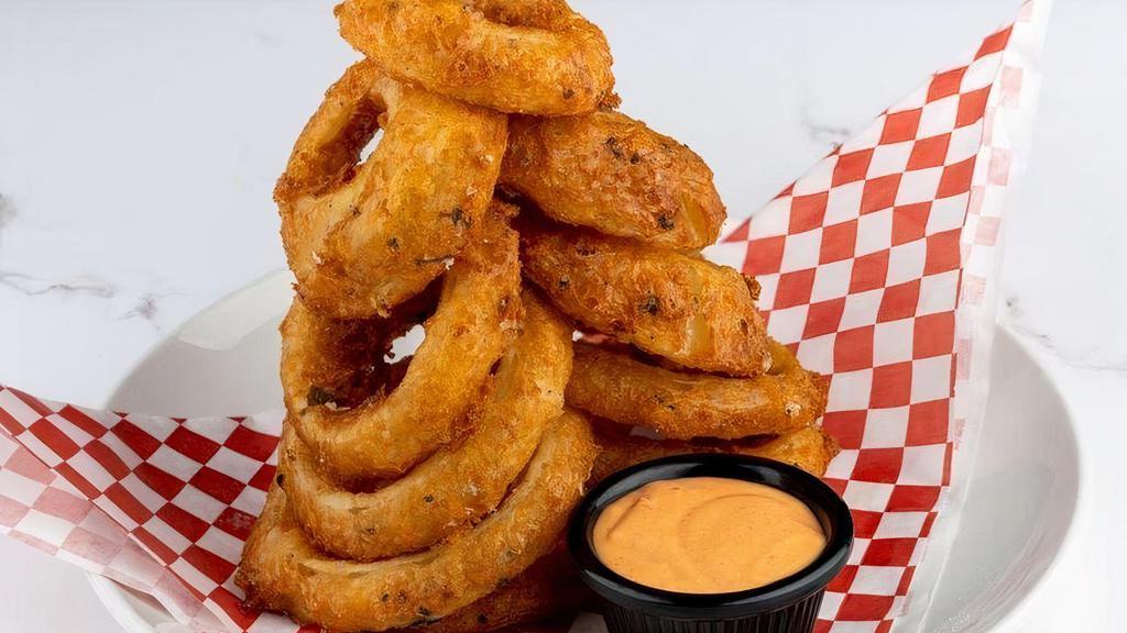 Beer Battered Onion Rings · Lightly fried and served with choice of peppercorn ranch or Sriracha dipping sauces.