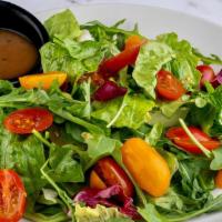 Garden Salad · Spring greens, cherry tomatoes and choice of salad dressing.