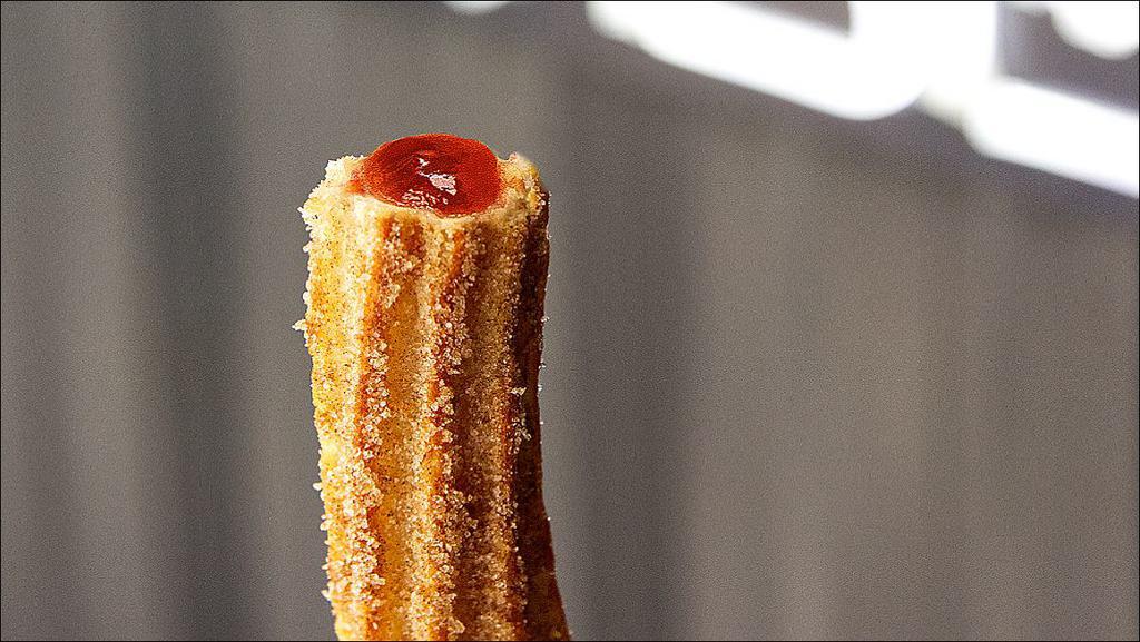 Strawberry Churro · Crispy Churro filled with Strawberry gently rolled in a cinnamon and sugar blend.