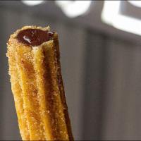 Chocolate Churro · Crispy Churro filled with Chocolate gently rolled in a cinnamon and sugar blend.