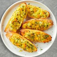 Garlic Bread With Cheese · (Vegetarian) Housemade bread toasted and garnished with butter, garlic, mozzarella cheese, a...