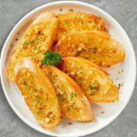 Garlic Bread  · (Vegetarian) Housemade bread toasted and garnished with butter, garlic, and parsley.