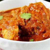 Curry · Boneless chicken cooked with spice creation's homemade secret sauce