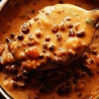 Dal Makhani · Assorted split beans puree with tomato, herbs and tempered with kashmiri chili oil